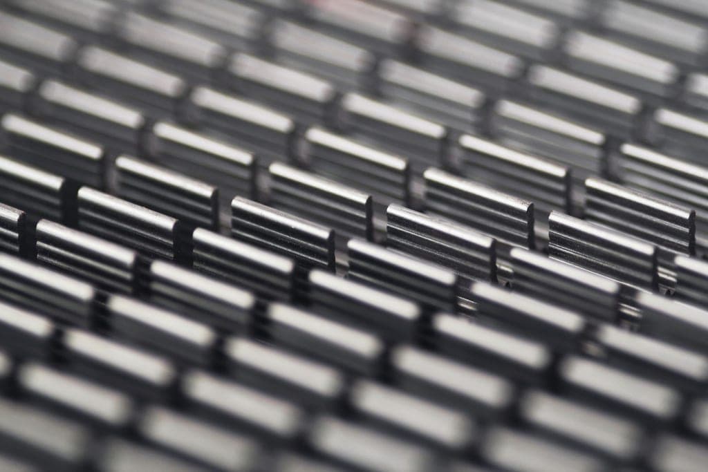 Layered metallic grid evoking a high-stack 3D NAND structure