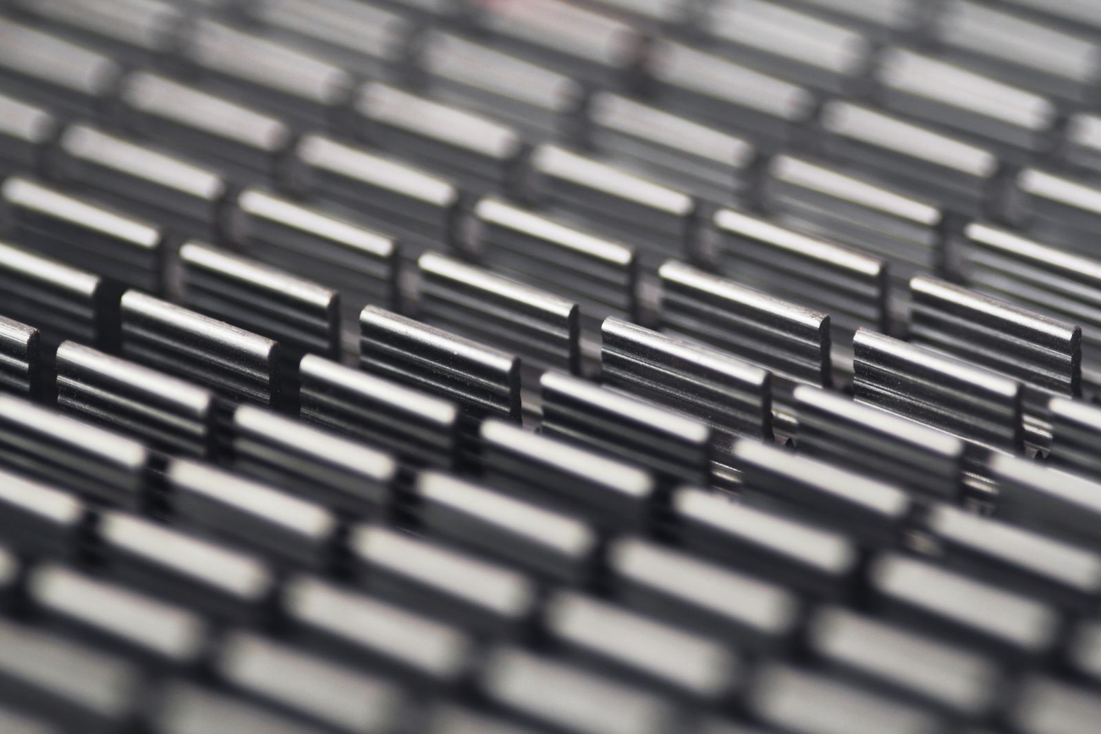 Layered metallic grid evoking a high-stack 3D NAND structure