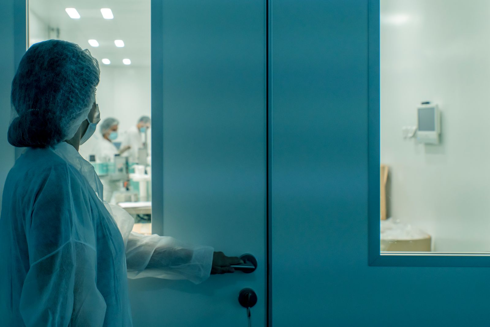Engineer working inside a semiconductor cleanroom